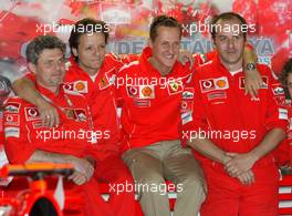 08.05.2004 Barcelona, Spain, F1, Saturday, May, celebrating the 200st GP in the Ferrari Box with the team, Michael Schumacher, GER, Ferrari - Formula 1 World Championship, Rd 5, Marlboro Spanish Grand Prix,  ESP