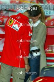 08.05.2004 Barcelona, Spain, F1, Saturday, May, celebrating the 200st GP in the Ferrari Box with the team, KISS,  Michael Schumacher, GER, Ferrari, Corina Schumacher, GER, Corinna, wife of Michael Schumacher, Portrait - Formula 1 World Championship, Rd 5, Marlboro Spanish Grand Prix,  ESP