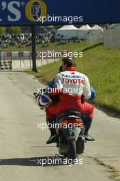 08.05.2004 Barcelona, Spain, F1, Saturday, May, Olivier Panis, FRA, Toyota gets a lift back to the pits after stopping on the circuit - Formula 1 World Championship, Rd 5, Marlboro Spanish Grand Prix Practice, ESP