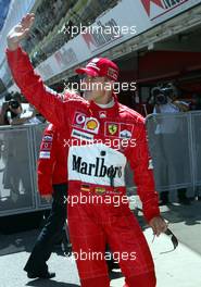 08.05.2004 Barcelona, Spain, F1, Saturday, May, Michael Schumacher, GER, Ferrari is waving to the fans after winning the Qualifying - Formula 1 World Championship, Rd 5, Marlboro Spanish Grand Prix Qualifying,  ESP