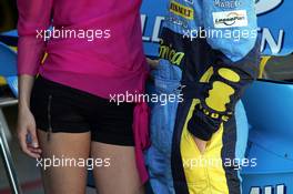 06.05.2004 Barcelona, Spain, F1, Thursday, May, a model is posing in the pitlane area, front of Renault, with Fernando Alonso, ESP, Renault F1 Team - Formula 1 World Championship, Rd 5, Marlboro Spanish Grand Prix, ESP