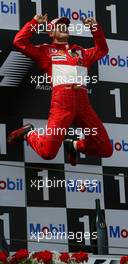 04.07.2004 Magny Cours, France, F1, Sunday, July, Michael Schumacher, GER, Ferrari, JUMPS - Formula 1 World Championship, Podium, Rd 10, Grand Prix de France, Circuit Nevers, FRA