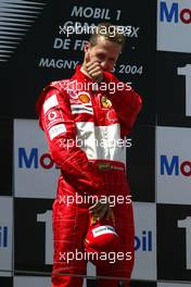 04.07.2004 Magny Cours, France, F1, Sunday, July, Michael Schumacher, GER, Ferrari, Portrait - Formula 1 World Championship, Podium, Rd 10, Grand Prix de France, Circuit Nevers, FRA