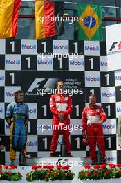 04.07.2004 Magny Cours, France, F1, Sunday, July, Michael Schumacher, GER, Ferrari with Fernando Alonso, ESP, Renault F1 Team and Rubens Barrichello, BRA, Ferrari - Formula 1 World Championship, Podium, Rd 10, Grand Prix de France, Circuit Nevers, FRA