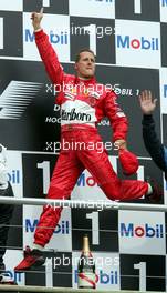 25.07.2004 Hockenheim, Germany, F1, Sunday. July, JUMP of Michael Schumacher, GER, Ferrari - Formula 1 World Championship, Rd 12, Podium, Grosser Mobil 1 Preis von Deutschland, GER, Hockenheimring Baden-Württemberg