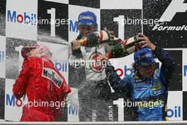 25.07.2004 Hockenheim, Germany, F1, Sunday. July, Michael Schumacher, GER, Ferrari with Jenson Button, GBR, BAR Honda and Fernando Alonso, ESP, Renault F1 Team - Formula 1 World Championship, Rd 12, Podium, Grosser Mobil 1 Preis von Deutschland, GER, Hockenheimring Baden-Württemberg