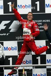 25.07.2004 Hockenheim, Germany, F1, Sunday. July, Michael Schumacher, GER, Ferrari jumps up into the air - Formula 1 World Championship, Rd 12, Podium, Grosser Mobil 1 Preis von Deutschland, GER, Hockenheimring Baden-Württemberg