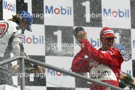 25.07.2004 Hockenheim, Germany, F1, Sunday. July, Jenson Button, GBR, BAR Honda and Michael Schumacher, GER, Ferrari - Formula 1 World Championship, Rd 12, Podium, Grosser Mobil 1 Preis von Deutschland, GER, Hockenheimring Baden-Württemberg