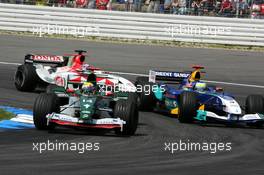 25.07.2004 Hockenheim, Germany,  F1, Sunday, Mark Webber (AUS), Jaguar Racing R5, overtakes Giancarlo Fisichella (ITA), Sauber Petronas C23 - Formula 1 World Championship, Rd 12, Grosser Mobil 1 Preis von Deutschland, GER, Hockenheimring Baden-Württemberg