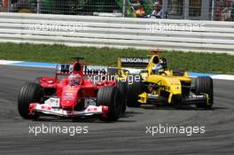 25.07.2004 Hockenheim, Germany,  F1, Sunday, Rubens Barrichello (BRA), Scuderia Ferrari Marlboro F2004, overtakes Nick Heidfeld (GER), Jordan Ford EJ14 - Formula 1 World Championship, Rd 12, Grosser Mobil 1 Preis von Deutschland, GER, Hockenheimring Baden-Württemberg