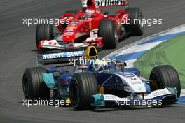 25.07.2004 Hockenheim, Germany, F1, Sunday. July, Giancarlo Fisichella, ITA, Sauber, C23, Action, Track leads Rubens Barrichello, BRA, Scuderia Ferrari Marlboro, F2004, Action, Track - Formula 1 World Championship, Rd 12, Race, Grosser Mobil 1 Preis von Deutschland, GER, Hockenheimring Baden-Württemberg