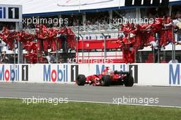 25.07.2004 Hockenheim, Germany,  F1, Sunday, Michael Schumacher (GER), Scuderia Ferrari Marlboro F2004, driving past his team after winning the race - Formula 1 World Championship, Rd 12, Grosser Mobil 1 Preis von Deutschland, GER, Hockenheimring Baden-Württemberg