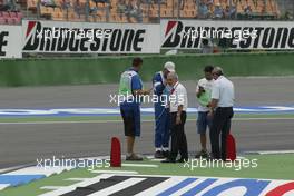 24.07.2004 Hockenheim, Germany, F1, Saturday, July, The first corner is checked after 2 cars lose their front wings in session 1 - Formula 1 World Championship, Rd 12, Practice, Grosser Mobil 1 Preis von Deutschland, GER, Hockenheimring Baden-Württemberg