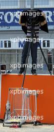 25.07.2004 Hockenheim, Germany, F1, Sunday. July, a photographer with an special construction for his treepod - Formula 1 World Championship, Rd 12, Grosser Mobil 1 Preis von Deutschland, GER, Hockenheimring Baden-Württemberg