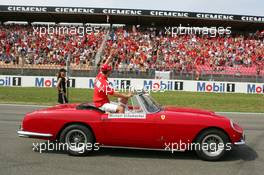 25.07.2004 Hockenheim, Germany,  F1, Sunday, Driver parade, Michael Schumacher (GER), Scuderia Ferrari Marlboro, Portrait, waving to the fans on the grandstand who great their favorite driver with a lot of noise - Formula 1 World Championship, Rd 12, Grosser Mobil 1 Preis von Deutschland, GER, Hockenheimring Baden-Württemberg