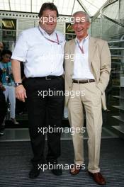 25.07.2004 Hockenheim, Germany,  F1, Sunday, Norbert Haug (GER), Sporting Director Mercedes-Benz (left) with Prof. Jürgen Hubbert (GER), Board of Management DaimlerChrysler, who celebrates his 65th birthday - Formula 1 World Championship, Rd 12, Grosser Mobil 1 Preis von Deutschland, GER, Hockenheimring Baden-Württemberg