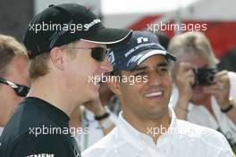 25.07.2004 Hockenheim, Germany, F1, Sunday. July, Kimi Raikkonen, FIN, Räikkönen, McLaren Mercedes and Juan-Pablo Montoya, COL, BMW WilliamsF1, team mates for 2005 - Formula 1 World Championship, Rd 12, Grosser Mobil 1 Preis von Deutschland, GER, Hockenheimring Baden-Württemberg