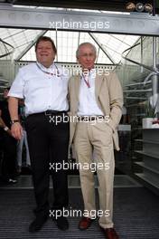 25.07.2004 Hockenheim, Germany, F1, Sunday. July, Norbert Haug, GER, Mercedes, Motorsport chief, and Prof. Jürgen Hubbert (Daimler Chrysler, Mercedes) 65th birthday - Formula 1 World Championship, Rd 12, Grosser Mobil 1 Preis von Deutschland, GER, Hockenheimring Baden-Württemberg