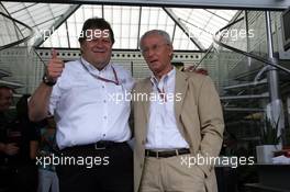 25.07.2004 Hockenheim, Germany, F1, Sunday. July, Norbert Haug, GER, Mercedes, Motorsport chief, and Prof. Jürgen Hubbert (Daimler Chrysler, Mercedes) 65th birthday - Formula 1 World Championship, Rd 12, Grosser Mobil 1 Preis von Deutschland, GER, Hockenheimring Baden-Württemberg