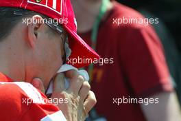 22.07.2004 Hockenheim, Germany, F1, Thursday, July, Michael Schumacher, GER, Ferrari blows his nose - Formula 1 World Championship, Rd 12, Grosser Mobil 1 Preis von Deutschland, GER, Hockenheimring Baden-Württemberg