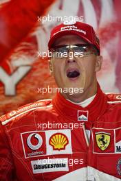 13.08.2004 Budapest, Hungary, F1, Friday, August, Michael Schumacher, GER, Ferrari yawning at the start of the session - Formula 1 World Championship, Practice, Rd 13, Hungarian Grand Prix, HUN, Hungaroring