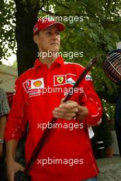 10.09.2004 Monza, Italy F1, Friday, September, Olympus Event in the evening - Michael Schumacher, GER, Ferrari  and Rubens Barrichello, BRA, Ferrari - Formula 1 World Championship, Rd 15, Italian Grand Prix, ITA, Italy