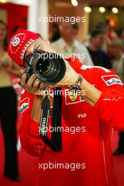 10.09.2004 Monza, Italy F1, Friday, September, Olympus Event in the evening - Michael Schumacher, GER, Ferrari  and Rubens Barrichello, BRA, Ferrari - Formula 1 World Championship, Rd 15, Italian Grand Prix, ITA, Italy