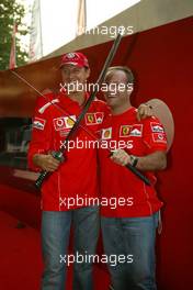 10.09.2004 Monza, Italy F1, Friday, September, Michael Schumacher, GER, Ferrari and Rubens Barrichello, BRA, Ferrari with swords - Formula 1 World Championship, Rd 15, Italian Grand Prix, ITA, Italy