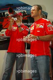 10.09.2004 Monza, Italy F1, Friday, September, Michael Schumacher, GER, Ferrari and Rubens Barrichello, BRA, Ferrari with Olympus cameras - Formula 1 World Championship, Rd 15, Italian Grand Prix, ITA, Italy