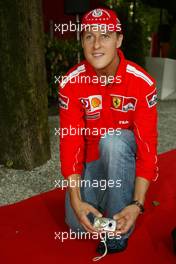 10.09.2004 Monza, Italy F1, Friday, September, Michael Schumacher, GER, Ferrari with an Olympus camera - Formula 1 World Championship, Rd 15, Italian Grand Prix, ITA, Italy