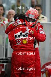 12.09.2004 Monza, Italy F1, Sunday, September, Michael Schumacher, GER, Ferrari with Gabrielle delli Colli, ITA, Ferrari race engineer - Formula 1 World Championship, Podium, Rd 15, Italian Grand Prix, ITA, Italy