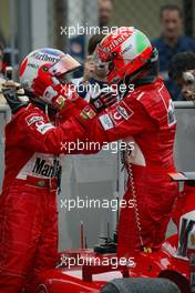 12.09.2004 Monza, Italy F1, Sunday, September, Rubens Barrichello, BRA, Ferrari and Michael Schumacher, GER, Ferrari - Formula 1 World Championship, Podium, Rd 15, Italian Grand Prix, ITA, Italy