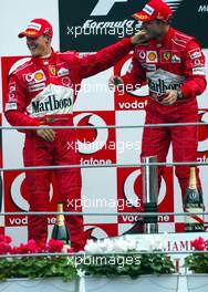 12.09.2004 Monza, Italy F1, Sunday, September, Michael Schumacher, GER, Ferrari, Rubens Barrichello, BRA, Ferrari - Formula 1 World Championship, Podium, Rd 15, Italian Grand Prix, ITA, Italy