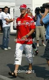 09.09.2004 Monza, Italy, F1, Thursday, September, Michael Schumacher, GER, Ferrari arrives at the paddock, wearing his NEW "7times world champion cap" - Formula 1 World Championship, Rd 15, Italian Grand Prix, ITA, Italy