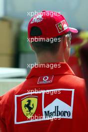 09.09.2004 Monza, Italy, F1, Thursday, September, Michael Schumacher, GER, Ferrari arrives at the paddock, wearing his NEW "7times world champion cap" - Formula 1 World Championship, Rd 15, Italian Grand Prix, ITA, Italy