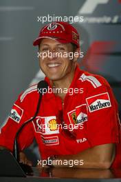 09.09.2004 Monza, Italy, F1, Thursday, September, Michael Schumacher, GER, Ferrari with his new 7 times world champion baseball cap - Official FIA Press Conference, Formula 1 World Championship, Rd 15, Italian Grand Prix, ITA, Italy