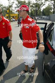 09.09.2004 Monza, Italy, F1, Thursday, September, Michael Schumacher, GER, Ferrari arrives at the paddock, wearing his NEW "7times world champion cap" - Formula 1 World Championship, Rd 15, Italian Grand Prix, ITA, Italy