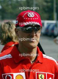 09.09.2004 Monza, Italy, F1, Thursday, September, Michael Schumacher, GER, Ferrari arrives at the paddock, wearing his NEW "7times world champion cap" - Formula 1 World Championship, Rd 15, Italian Grand Prix, ITA, Italy