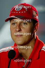 09.09.2004 Monza, Italy, F1, Thursday, September, Michael Schumacher, GER, Ferrari with his new 7 times world champion baseball cap - Official FIA Press Conference, Formula 1 World Championship, Rd 15, Italian Grand Prix, ITA, Italy