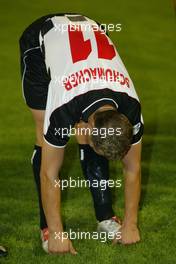 08.09.2004 Monza, Italy F1, Wednesday, September, Michael Schumacher, GER, Ferrari warms up - Charity football match, Stadio Brianteo, Formula 1 World Championship, ITA, Italy