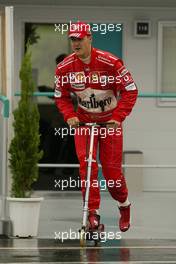 08.10.2004 Suzuka, Japan, F1, Friday, October, Michael Schumacher, GER, Ferrari on his scooter -  Formula 1 World Championship, Rd 17, Japanese Grand Prix, JPN, Japan