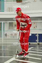 08.10.2004 Suzuka, Japan, F1, Friday, October, Michael Schumacher, GER, Ferrari on his scooter -  Formula 1 World Championship, Rd 17, Japanese Grand Prix, JPN, Japan