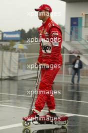 08.10.2004 Suzuka, Japan, F1, Friday, October, Michael Schumacher, GER, Ferrari on his scooter -  Formula 1 World Championship, Rd 17, Japanese Grand Prix, JPN, Japan