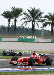 19.03.2004 Sepang, Malaysia, F1, Friday, March, Michael Schumacher, GER, Scuderia Ferrari Marlboro, F2004, Action, Track leads Kimi Raikkonen, FIN, Räikkönen, West McLaren Mercedes, MP4-19, Action, Track, Formula 1 World Championship, Rd 2, Malaysian Grand Prix, KUL, Kuala Lumpur