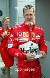 20.03.2004 Sepang, Malaysia, F1, Saturday, March, Michael Schumacher, GER, Ferrari after he got the Pole Position for the race, Paddock Area, Qualifying, Formula 1 World Championship Rd 2, Malaysian Grand Prix, KUL, Kuala Lumpur