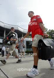 18.03.2004 Sepang, Malaysia, F1, Thursday, March, Michael Schumacher, GER, Ferrari, arrives at the track, Formula 1 World Championship, Rd 2, Malaysian Grand Prix, KUL, Kuala Lumpur