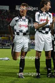 21.04.2004 Forli, Italy, Charity football match at Stadio Morgani / Forli between current and former F1 drivers, and the Brazilian 1994 Soccer team, Michael Schumacher, GER, Ferrari warms up, Wednesday, April, Formula 1 World Championship, Rd 4, San Marino Grand Prix, RSM