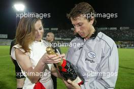 21.04.2004 Forli, Italy, QIS, Charity football match at Stadio Morgani / Forli between current and former F1 drivers, and the Brazilian 1994 Soccer team, Montezemolo poses with a Champagne Mumm Jeroboam which has been signed by the drivers and Brazilians who played in the football match. The Jeroboam will be auctioned for charity. Wednesday, April, Formula 1 World Championship, Rd 4, San Marino Grand Prix, RSM - Mumm Copyright Free