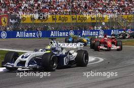 25.04.2004 Imola, San Marino, F1, Sunday, April, Ralf Schumacher, GER, BMW WilliamsF1 Team, FW26, Action, Track leads Rubens Barrichello, BRA, Ferrari - Formula 1 World Championship, race, Rd 4, San Marino Grand Prix, RSM