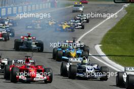 25.04.2004 Imola, San Marino, F1, Sunday, April, Rubens Barrichello, BRA, Ferrari, Ralf Schumacher, GER, BMW WilliamsF1, Jarno Trulli, ITA, Mild Seven Renault F1 Team, R24, Action, Track - the start of the race, Formula 1 World Championship, race, Rd 4, San Marino Grand Prix, RSM